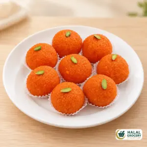 Motichur laddu on a plate with Halal Grocery logo